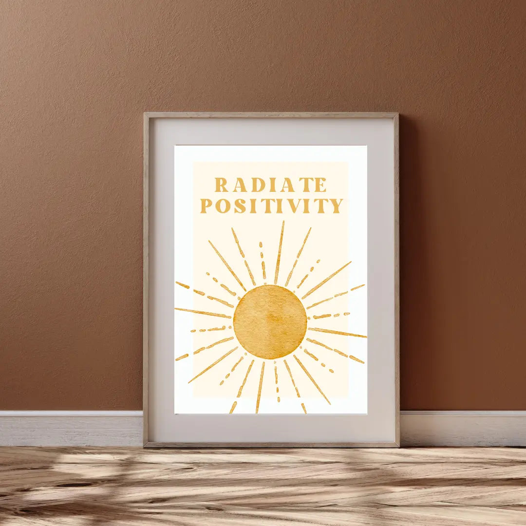 ForWalls.eu - Plakat Radiate Positivity - Minimalist poster with golden sunburst and "Radiate Positivity" text in bold uppercase on white background. - minimalistyczny, plakat, well-being