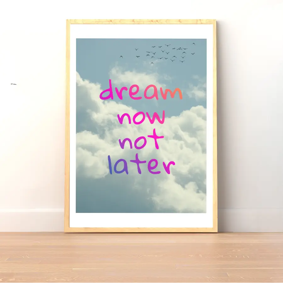 ForWalls.eu - Plakat Dream Now Not Later - Pink and purple "dream now not later" text over blue sky with fluffy clouds and flying birds, framed poster on floor. - plakat, typografia, well-being