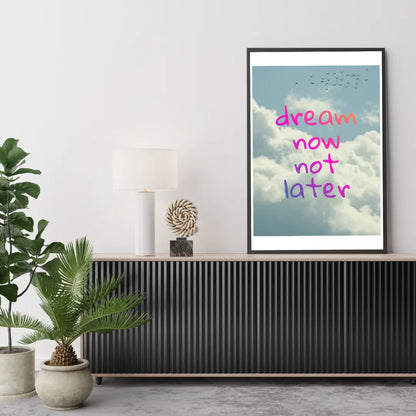 ForWalls.eu - Plakat Dream Now Not Later - Framed poster with blue sky and clouds background, bright pink handwritten text "dream now not later" in center. - plakat, typografia, well-being