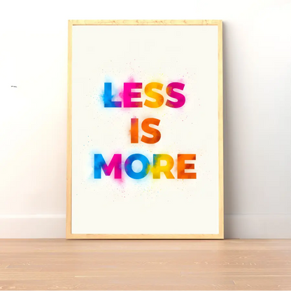 ForWalls.eu - Plakat Less Is More - Minimalist poster with "LESS IS MORE" in bold, colorful typography on white background, framed in light wood. - minimalistyczny, plakat, typografia