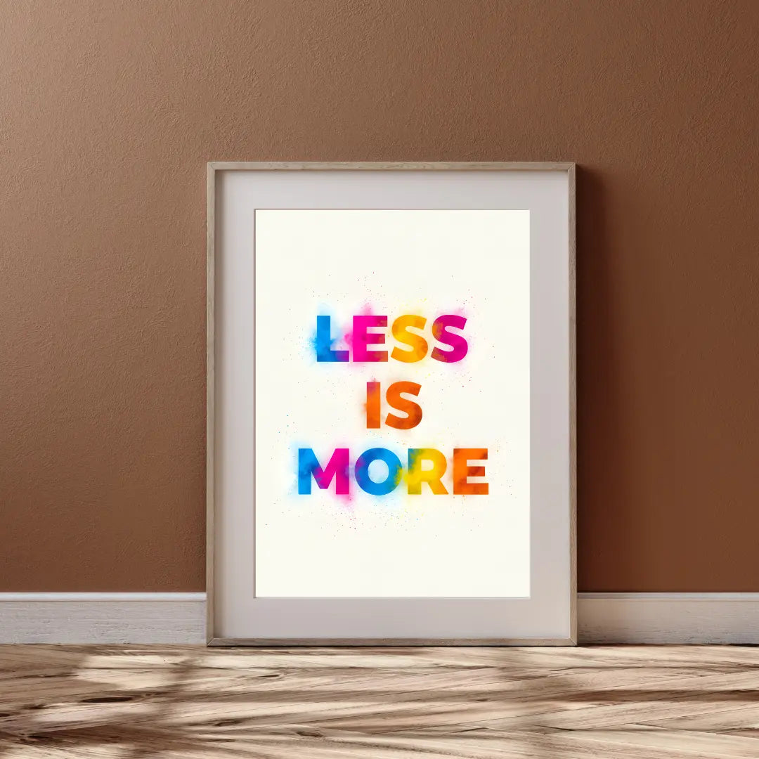 ForWalls.eu - Plakat Less Is More - Minimalist poster with "LESS IS MORE" in bold, colorful letters on a white background, framed in light wood. - minimalistyczny, plakat, typografia