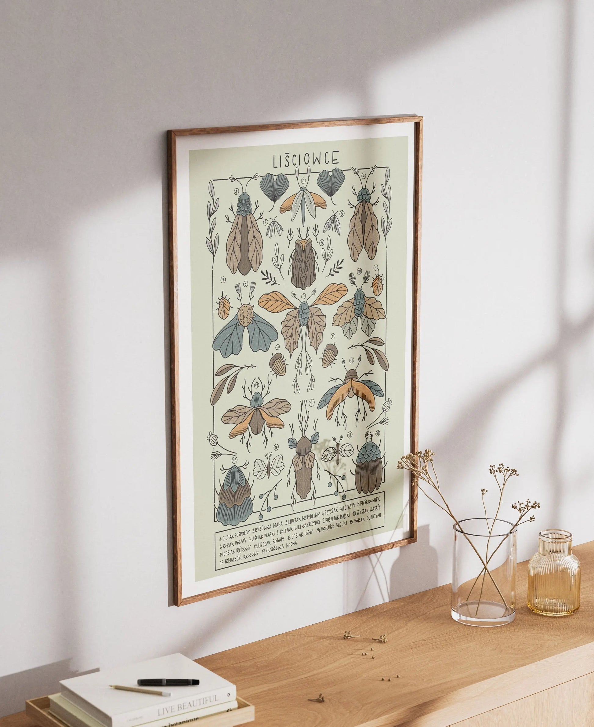 ForWalls.eu - Plakat Liściowce - Framed botanical poster with detailed illustrations of six Monstera leaves in muted green and brown tones on cream paper. - Luiza Kwiatkowska, plakat, print